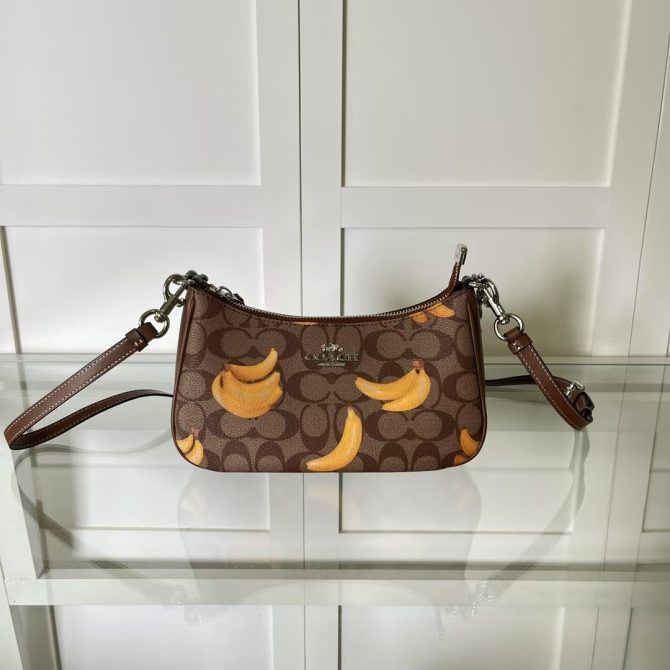 Women's COACH Teri Shoulder Bag - Brown Signature Canvas with Banana Print - Fashion Accessory